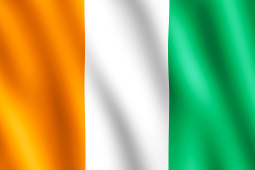 Flag of Cote d'Ivoire/Ivory Coast waving in the wind giving an undulating texture of folds in the fabric. The Image is in the official ratio of the flag - 2:3.