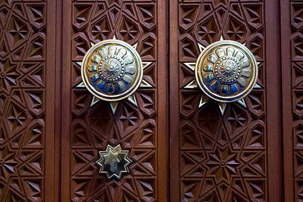 Omani Grand Mosque Door Detail. Wooden door richly decorated. Close-up