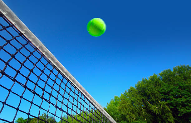istock Tennis ball on net´s edge 505047407