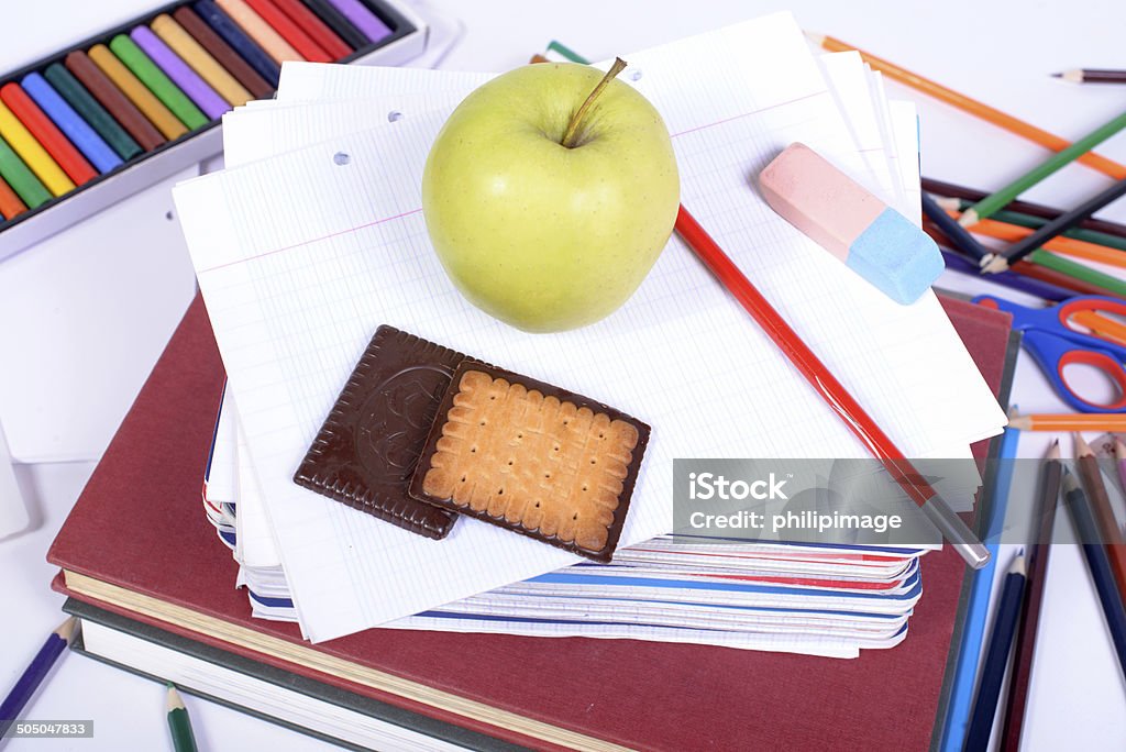 school supplies with an apple school supplies with an apple on the white background Apple - Fruit Stock Photo