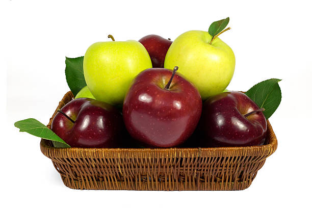 istock Fresh Red and Green Apples with Leaves in Wicker Basket 505048193