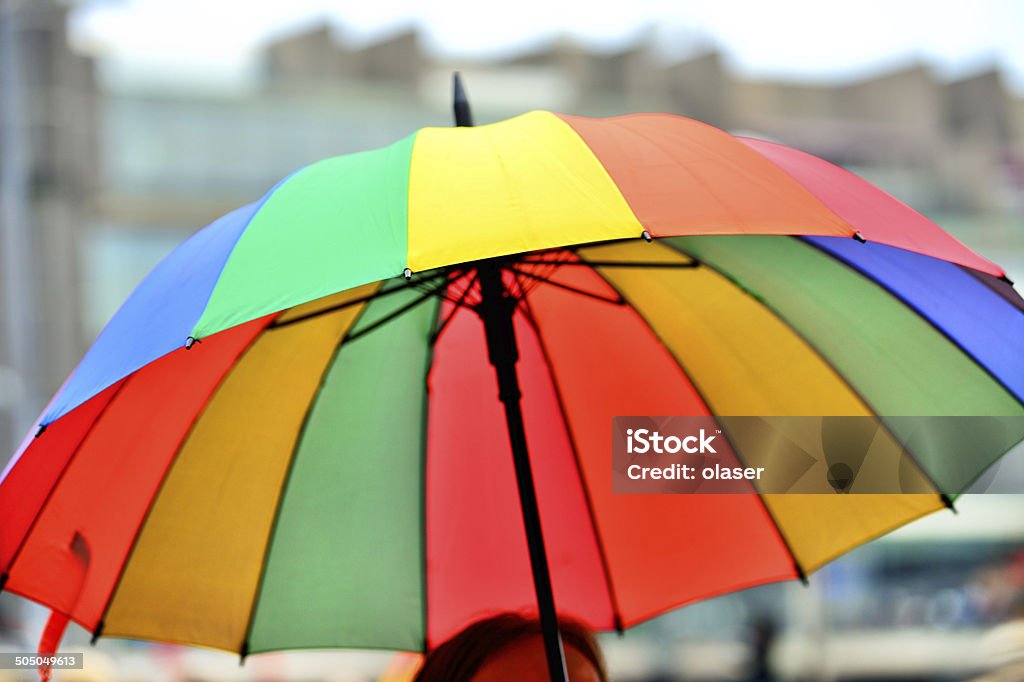 Rainbow colored umbrella Umbrella in the city Rainbow Stock Photo