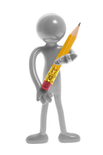 istock Miniature Figure Holding Pencil 505050455
