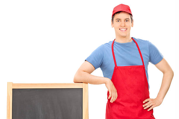 istock Young vendor standing by a blackboard 505051635
