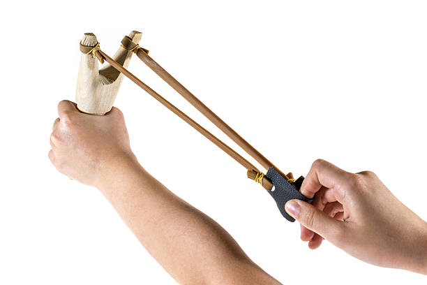 istock catapult slingshot isolated on white background with kid hand pu 505051797