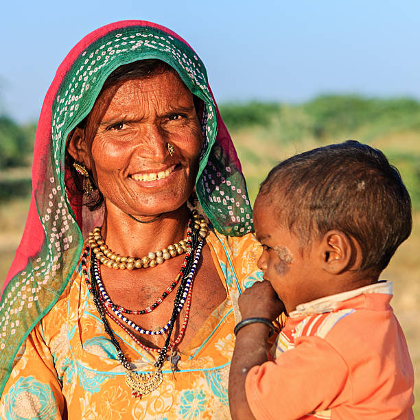 istock Indian woman holding her child 505058614