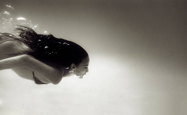 istock Little Girl Diving Underwater 505059780