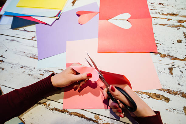 istock cutting out paper heart 505060480