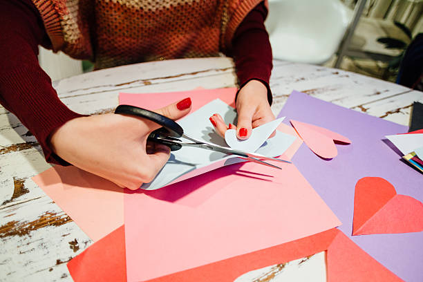 istock cutting out paper heart 505060600