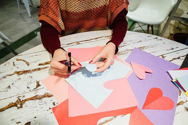 istock cutting out paper heart 505060646
