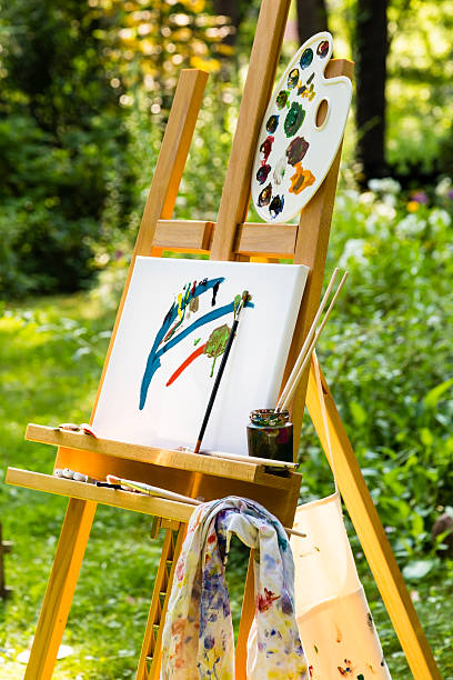 istock easel with canvas in a garden 505060850