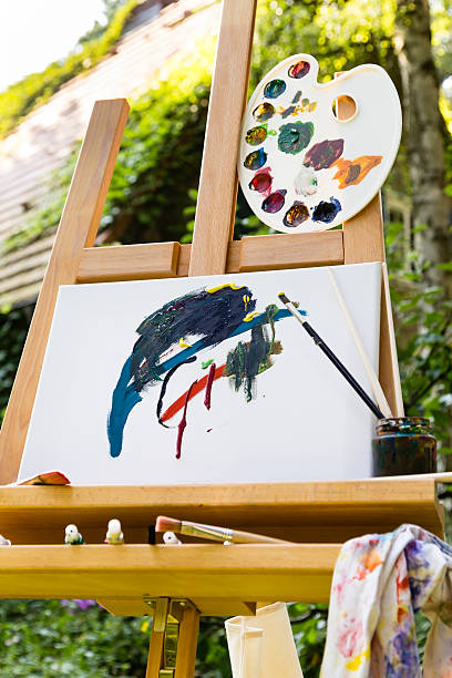 istock easel with canvas in a garden 505060998