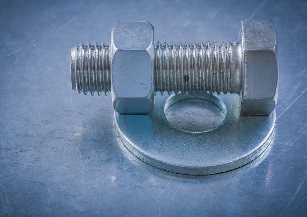 istock Bolt washers screwbolts construction nuts on metallic background 505061258