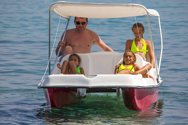 istock Family on the pedal boat 505062514