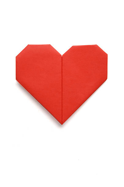 Valentine greeting paper folded origami love heart isolated on w Valentine greeting paper folded origami love heart isolated on white origami stock pictures, royalty-free photos & images