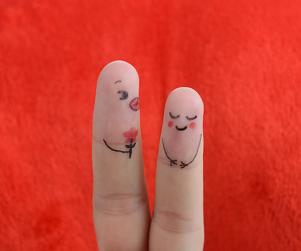 istock Painted finger smiley on red background, valentine concept. 505064246