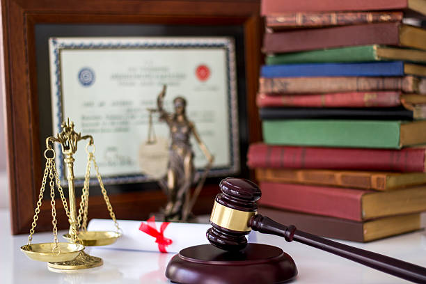 Law concept, statue, gavel, scale, books and degree stock photo
