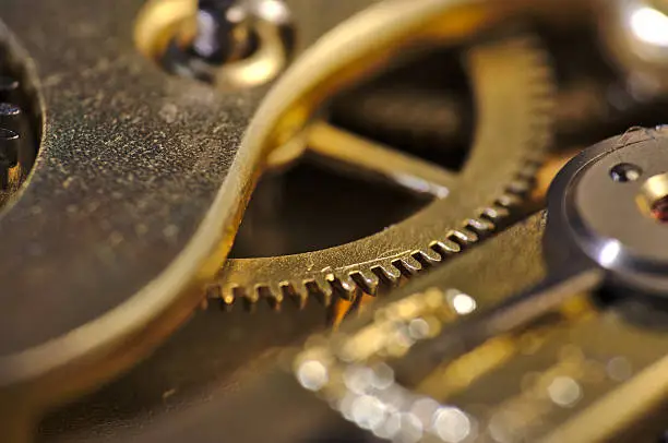 Macro photograph of an old watch internals, steampunk and vintage theme