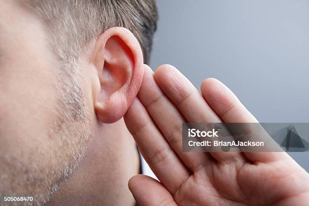 Listening Stock Photo - Download Image Now - Listening, Ear Exam, Noise