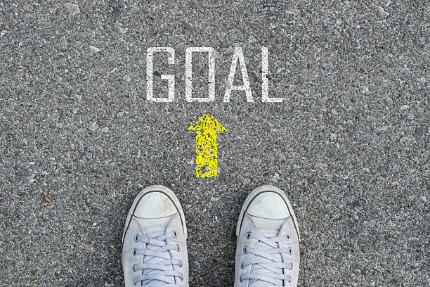 istock Feet on road with GOAL 505069028