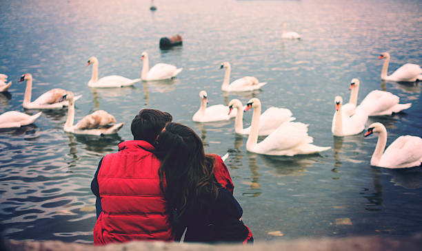 istock Couple sitting by the river. 505070330