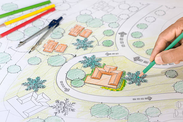 istock Landscape Architect Designs Blueprints For Resort. 505070952
