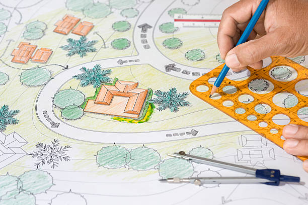 istock Landscape Architect Designs Blueprints For Resort. 505071178