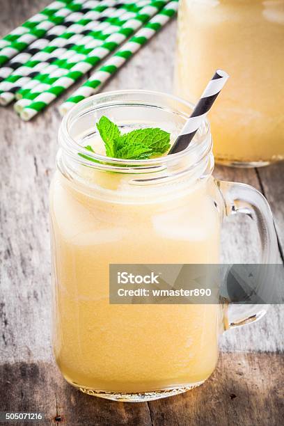 Melon Smoothie In A Glass Jar With Mint Stock Photo - Download Image Now - Airtight, Breakfast, Cantaloupe