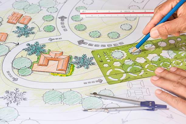 istock Landscape Architect Designs Blueprints For Resort. 505071296