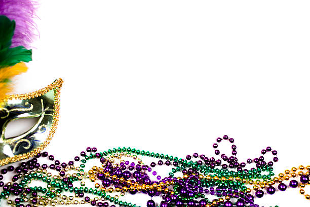 istock Mardi Gras background.  Purple, gold, green, mask, beads. 505071416