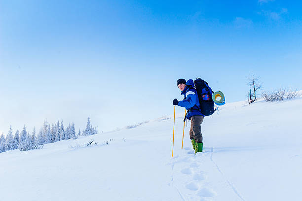 istock tourist in winter mountains 505072388