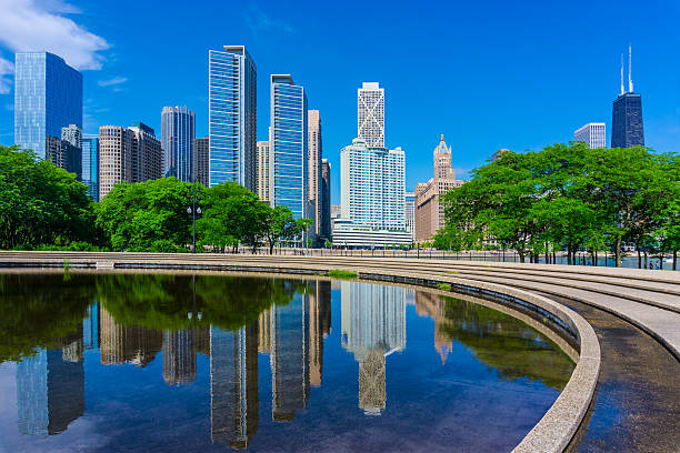Chicago skyline reflected in a fountain base; Illinois