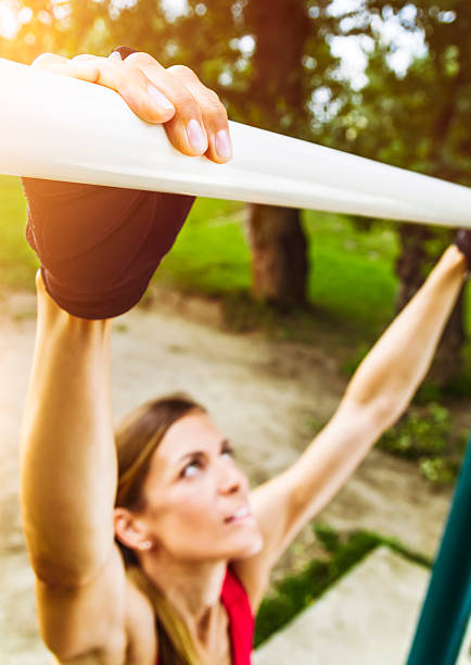 istock Female athlete getting ready for pull-ups outdoors 505082383