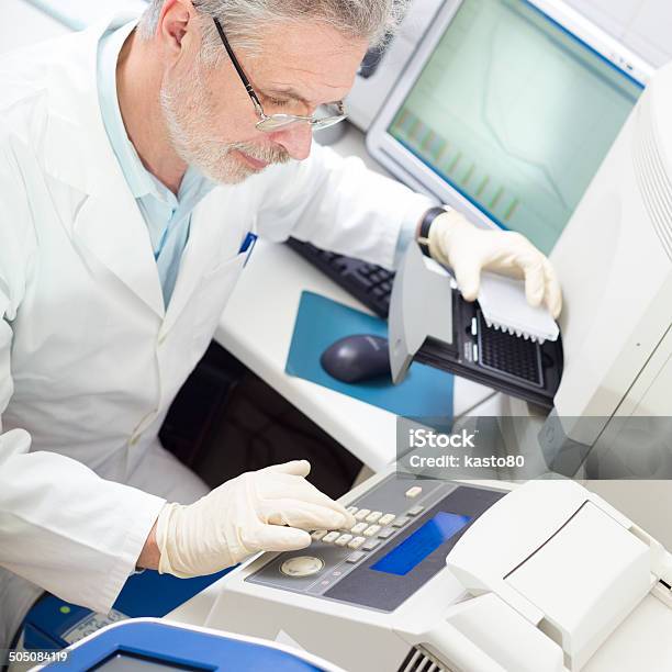 Life Scientist Researching In The Laboratory Stock Photo - Download Image Now - Adult, Adults Only, Analyzing