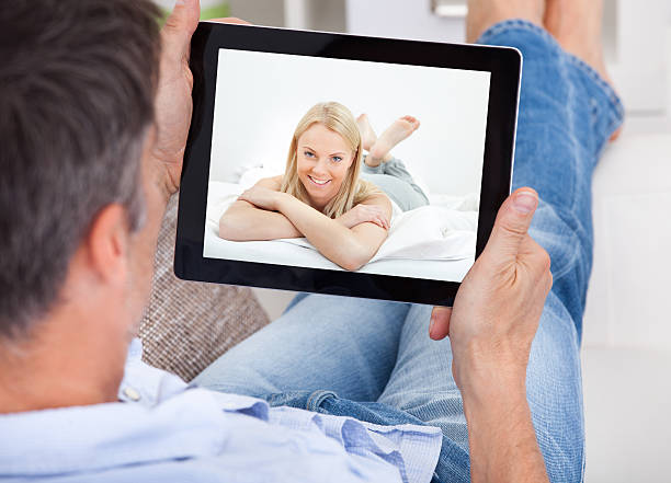 istock Man Video Chatting With Woman 505085481