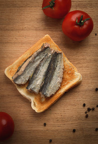 istock Canned sardines on toasted slice of bread 505085782