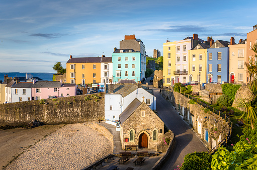 Pastel Coloured Town Houses overlooking the Harbour at Sunset. Tenby, Wales, UK.