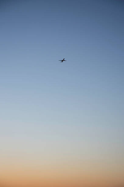 istock Airplane flying in the distance 505087484