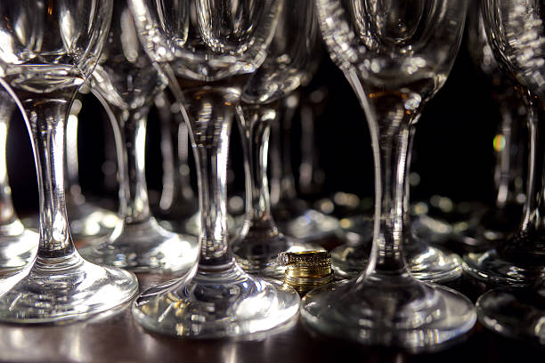 istock wedding rings near glasses 505088160