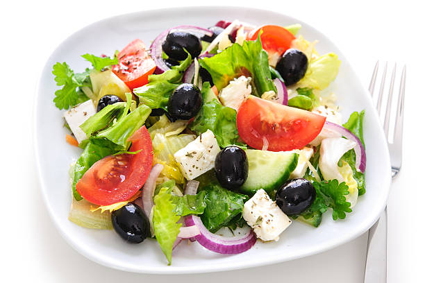 istock Greek salad isolated on white 505089730