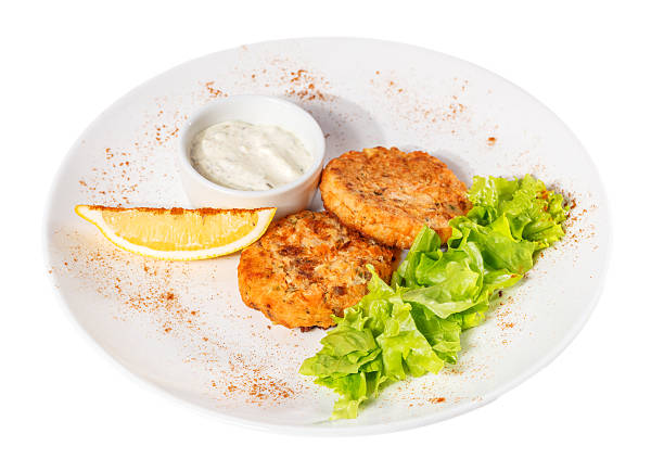 istock Cutlets with salad leaves, sauce and lemon 505090576