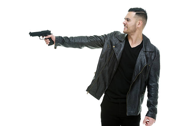 istock Casual man shooting with gun 505092354