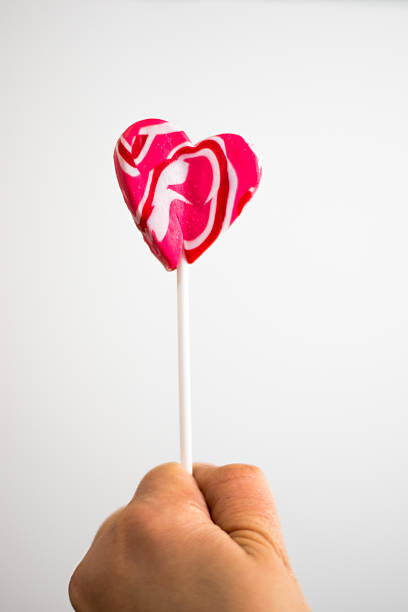 istock Heart lolipop in hand valentines day 505092942