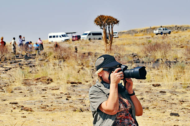 istock Nature photographer in action 505094038