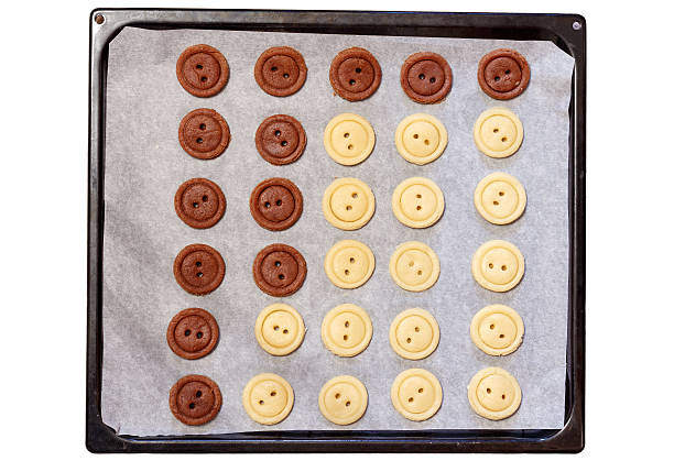 Raw dough. Yellow and brown cookies buttons. stock photo