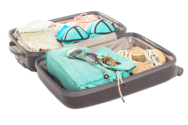 istock Packed suitcase full of vacation items. 505096740