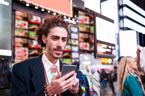 istock Man with cell phone in New York City. 505097576