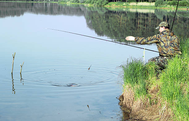 istock The fisherman pulls the fish ashore 505097888