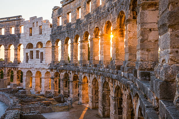 Architectural Details of Pula Coliseum, Croatina Architecture Details of the Roman Amphitheater Arena in Sunny Summer Evening. Famous Travel Destination in Pula, Croatia. amphitheater stock pictures, royalty-free photos & images