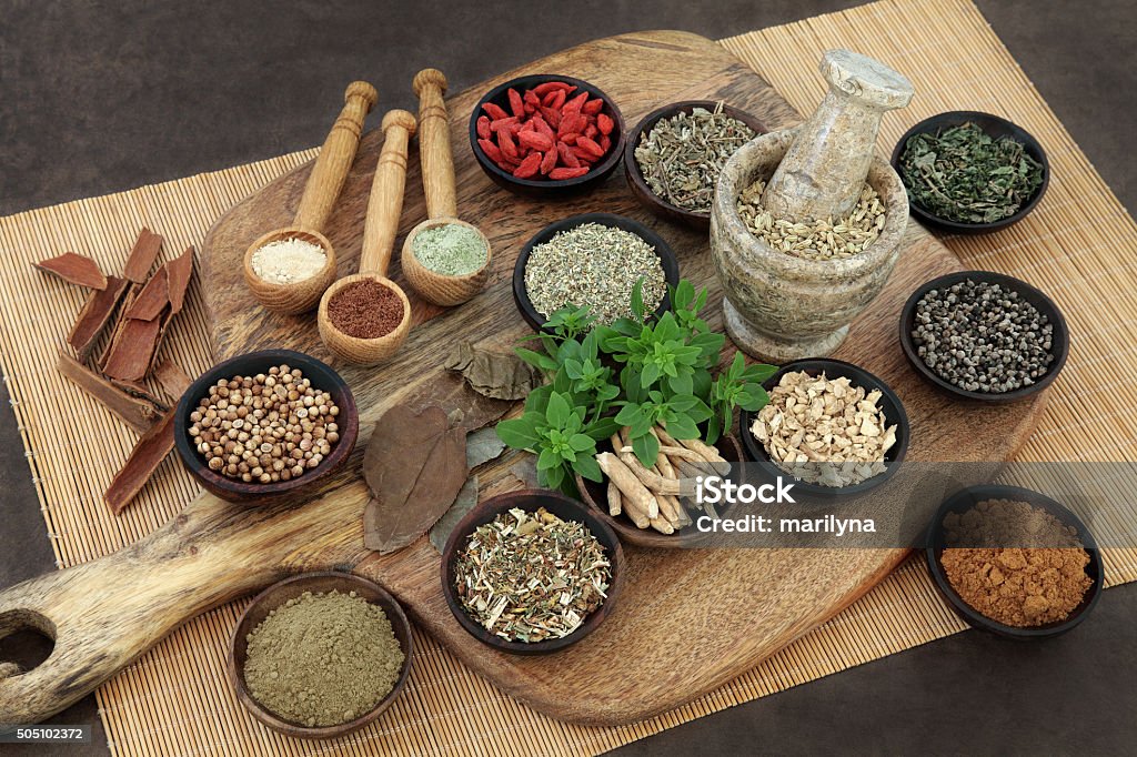 Herbs and Spices for Mens Health Herb and spice health food selection for men in wooden bowls and spoons. Used in natural alternative herbal medicine. Ayurveda Stock Photo